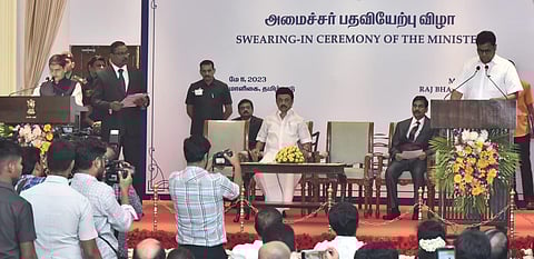 Governor RN Ravi administers oath to TRB Raja as minister at a function held at Raj Bhavan, while Chief Minister MK Stalin looks on. (Photo | P Jawahar, EPS)
