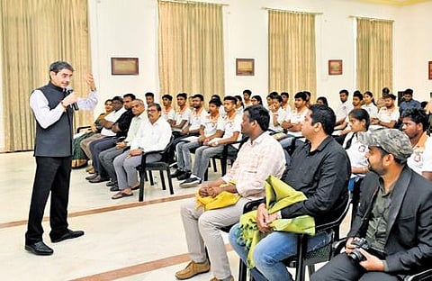 Governer RN Ravi talking to students from Bihar on Friday | Express