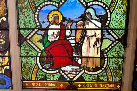 Stained-glass window depicts Christ speaking to a Samaritan woman, in the now-closed St. Mark's Episcopal church. ( Photo | AP )