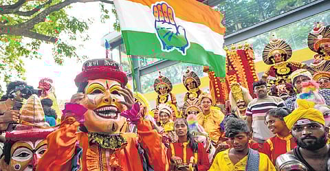 Folk artistes perform during Congress’s celebrations after the party’s win in Assembly elections in Bengaluru on Saturday. (Photo | PTI)