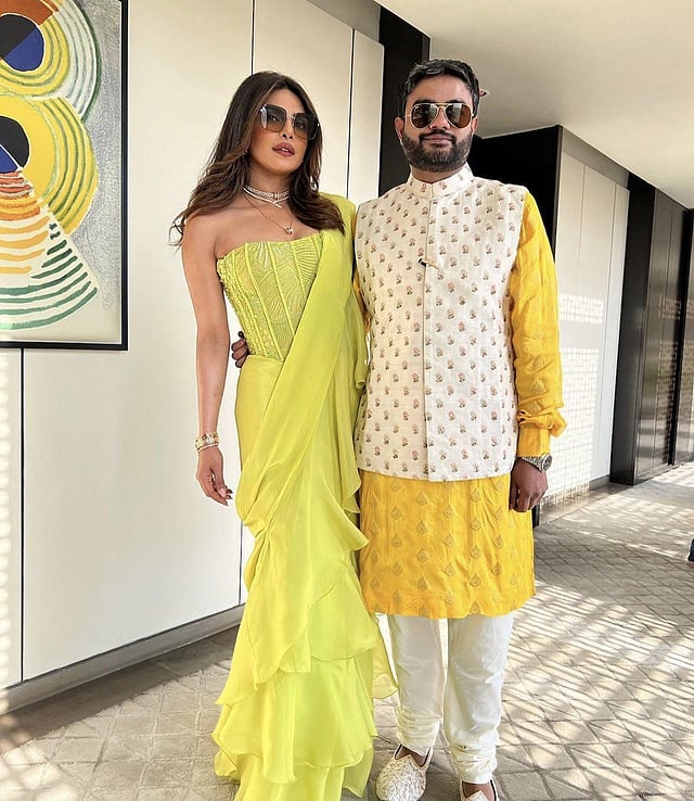 Actor Priyanka Chopra and her brother Siddharth Chopra at their cousin's engagement ceremony. Priyanka wore a neon green corset saree by Mishru. (Photo | Siddharth Chopra Instagram)