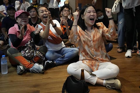 Supporters of Move Forward party cheer as they watch counting of votes on television at Move Forward Party headquarters in Bangkok, Thailand, Sunday, May 14, 2023. (Photo | AP)