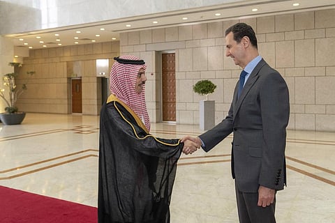 Syrian President Bashar Assad, right, welcomes Saudi Minster of Foreign Affairs Faisal bin Farhan, left, before their meeting in Damascus, Syria, on April 18, 2023. (Photo | AP)