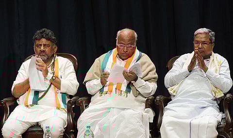 Congress President Mallikarjun Kharge with former Karnataka CM Siddaramaiah and KPCC chief DK Shivakumar in Bengaluru, Saturday, May 13, 2023. (Photo | PTI)