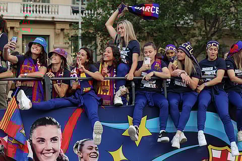 FC Barcelona women football team parade aboard a open-top bus. ( Photo | AFP )