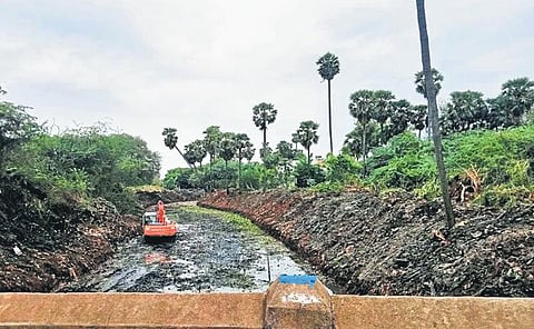 The Uyyakondan channel in Elakudi of Thiruvermbur taluk being desilted | Express