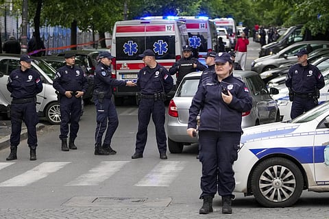 Police force outside the elementary school in central Belgrade , Serbia. (Photo | AP)