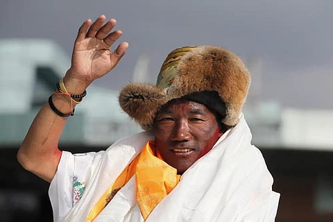 FILE - In this May 20, 2018, file photo, Nepalese veteran Sherpa guide, Kami Rita waves as he arrives in Kathmandu, Nepal. (Photo | AP)