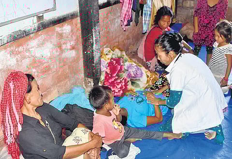(L) Women personnel of Assam Rifles interact with locals as part of Area Domination Patrol to restore peace and harmony in violence-hit Manipur; a doctor treats violence-affected people from Manipur a
