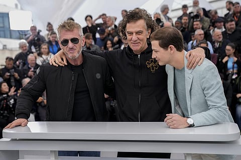 Sean Penn, from left, director Jean-Stephane Sauvaire, and Tye Sheridan pose for photographers for the film 'Black Flies' at the 76th international film festival, Cannes. (Photo | AP)