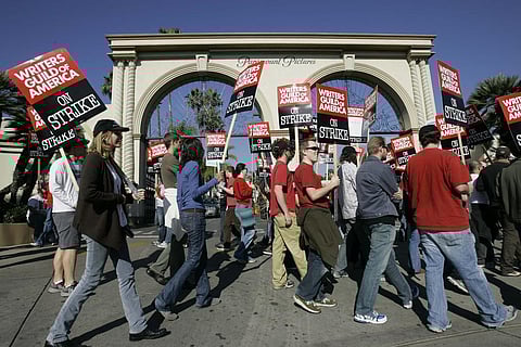 Striking writers walk the picket line outside Paramount Studios in Los Angeles on Dec. 13, 2007. (Photo | AP)