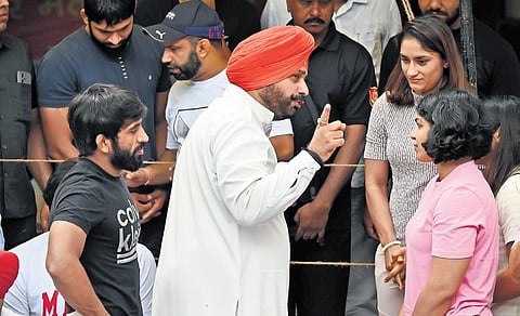 Congress leader and former India cricketer Navjot Singh Sidhu (C) visited the protesting wrestlers at the Jantar Mantar in New Delhi, on Monday | Shekhar yadav