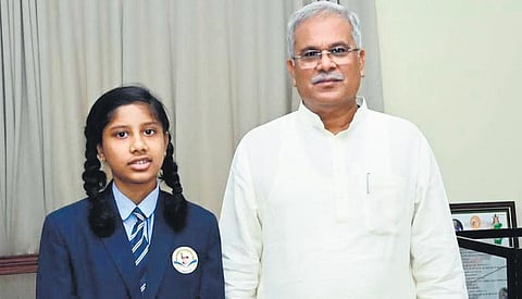 Nargis Khan, a student of Class VII with Chhattisgarh CM Bhupendra Baghel | express
