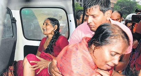 Relatives of the deceased woman in deep grief on Sunday.