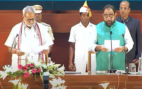Senior BJD leader and former Speaker Bikram Keshari Arukha takes oath as the new finance minister of the Odisha state. (Photo | EPS)