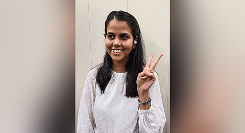 UPSC civil services examination topper Ishita Kishore shows the victory sign, in Noida. (Photo | PTI)
