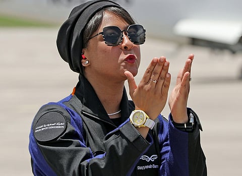 Rayyanah Barnavi blows kisses to family members upon her arrival at the Kennedy Space Centre. (Photo | AFP)