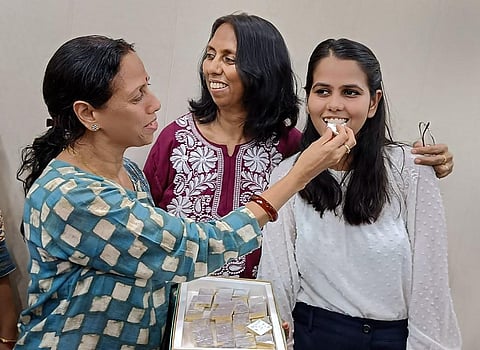 UPSC civil services examination 2022 topper Ishita Kishore celebrates with family members in Greater Noida, May 23, 2023. (PTI)