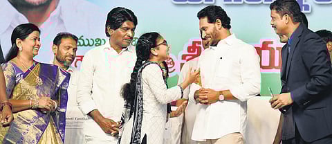CM YS Jagan Mohan Reddy interacting with a student during Jagananna Vidya Deevena scheme funds distribution programme in Tiruvur.(File Photo | Express)