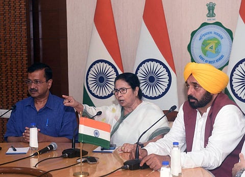 West Bengal CM Mamata Banerjee, Delhi CM Arvind Kejriwal and Punjab CM Bhagwant Mann address a joint press conference, at Nabanna in Howrah on Tuesday. (Photo | ANI)