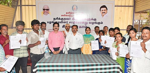 Collector AP Mahabharathi distributing community certificate to Narikuravar tribals in Pallavarayanpettai on Tuesday | Express