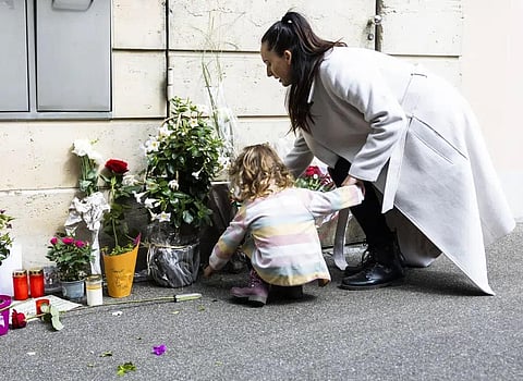 A mother and her daughter lay down flowers at the gate of the house of late singer and stage performer Tina Turner in Kuesnacht, Switzerland, on May 25, 2023. (Photo | AP)
