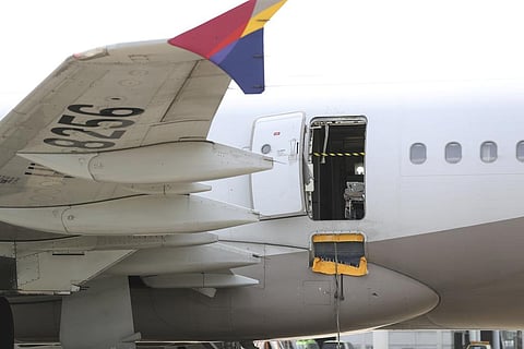 An Asiana Airlines plane is parked as one of the plane's doors suddenly opened at Daegu International Airport in Daegu, South Korea, Friday, May 26, 2023 | AP