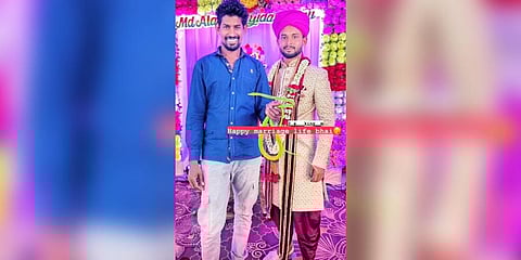 The viral photo of Hanumesh posing with a snake during a marriage in Vijayapura. (Photo  | EPS)