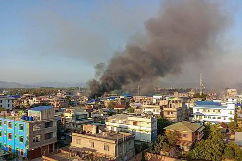Smoke billows from a fire that broke out amid clashes between armed groups and security forces, in Manipur, Sunday, May 28, 2023. (Photo | PTI)