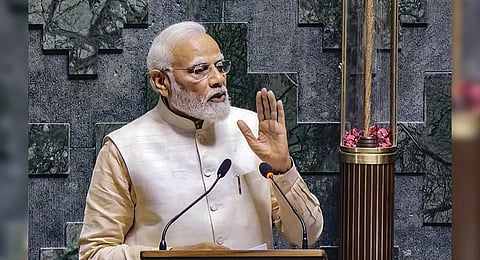Prime Minister Narendra Modi addresses a gathering inside the Lok Sabha chamber, at the new Parliament building in New Delhi. (Photo | PTI)