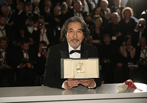 Koji Yakusho, winner of the award for best actor for 'Perfect Days', poses during a photo call following the awards ceremony at the 76th international film festival, Cannes, May 27, 2023. (AP)