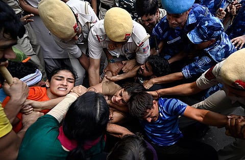 Top wrestlers, including the likes of Vinesh Phogat, Sakshi Malik and Bajrang Punia, were detained for violation of law and order after they breached the security cordon while trying to move towards the new Parliament building for a planned women's 'Mahap