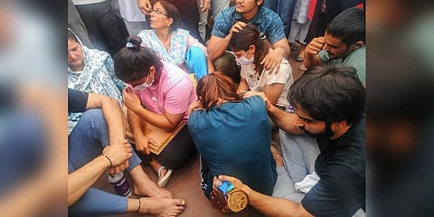 Protesting wrestlers sit at Har ki Pauri, in Haridwar district, Tuesday, May 30, 2023. (Photo | PTI)