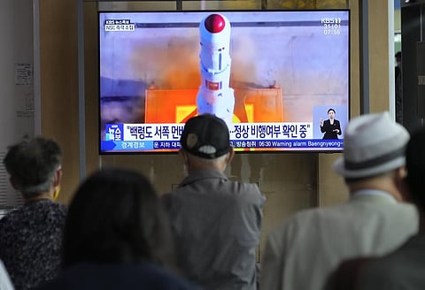 A TV screen shows a file image of North Korea's rocket launch during a news program at the Seoul Railway Station in Seoul, South Korea. (Photo | AP)