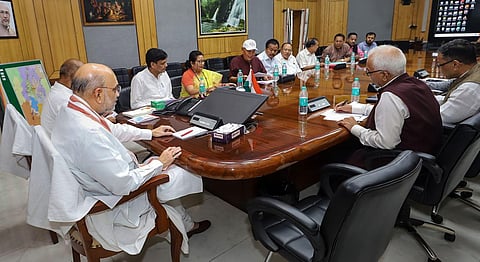 Union Home Minister Amit Shah chairs a meeting with a delegation of leaders from various political parties, in Imphal, Tuesday, May 30, 2023. (Photo | PTI)