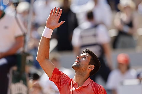 Novak Djokovic celebrates after winning his first round match in the French Open against Aleksandar Kovacevic (Photo | AP)