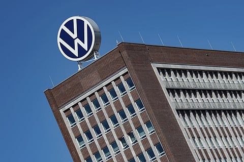 The Volkswagen logo stand on the top of a VW headquarters building in Wolfsburg, Germany, Monday, April 27, 2020. (Photo | AP)