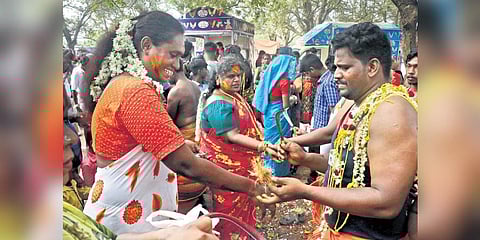 A priest cuts the thali and breaks bangles of transgender devotees at the Koothandavar temple in Koovagam on Wednesday | R Sriram