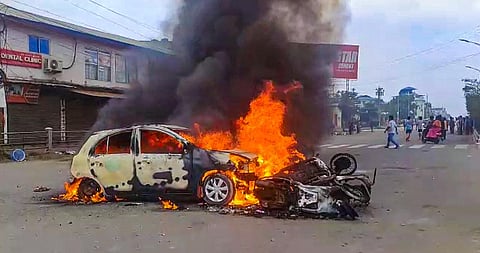 Vehicles in flames after violence broke out during the 'Tribal Solidarity March' called by All Tribal Student Union Manipur, in Imphal, on May 4, 2023. (Photo | PTI)