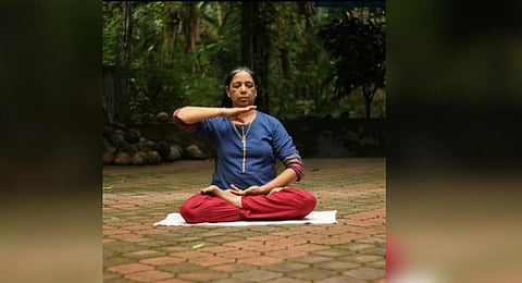 'Bhavani Odatt practising a Falun Gong exercise'