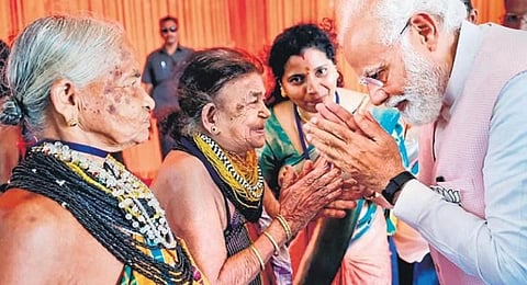 Prime Minister Narendra Modi meets Padma Shri recipients Tulsi Gowda and Sukri Bommagowda during his visit to Ankola, Uttara Kannada, on Wednesday 