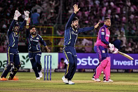 Gujarat Titans' Rashid Khan with teammates appeals for the dismissal of Shimron Hetmyer during the IPL 2023 cricket match against Rajasthan Royals in Jaipur, May 5, 2023. (Photo | PTI)