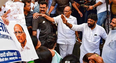 Nationalist Congress Party's (NCP) Sharad Pawar interacts with party workers and supporters during their 'dharna' urging Pawar to withdraw his resignation (Photo | PTI)