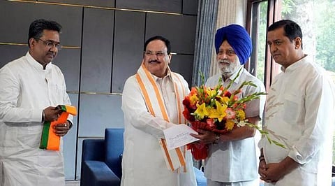 Charanjit Singh Atwal , joins BJP in the presence of party national president JP Nadda. (Photo | PTI)