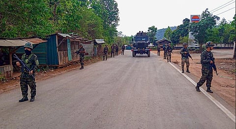 Army and Assam Rifles personnel conduct a flag march in violence-hit areas across Manipur, May 5, 2023. (Photo | PTI)