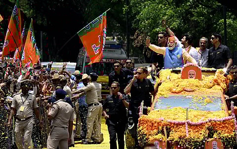 Prime Minister Narendra Modi began a roadshow in Bengaluru on Saturday morning, campaigning for the BJP, ahead of the May 10 Assembly polls in Karnataka. (Photo | Shashidhar Byrappa, EPS)