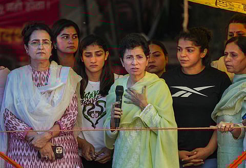Congress leaders Kumari Selja and Kiran Choudhary with wrestlers Sakshi Malik and Sangeeta Phogat during the wrestlers' protest at Jantar Mantar, in New Delhi, May 5, 2023. (Photo | PTI)