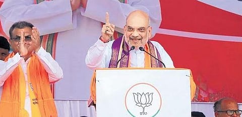 ​  Home Minister Amit Shah addresses an election campaign rally ahead of Assembly polls in Athani, Karnataka, on Saturday  | PTI  ​