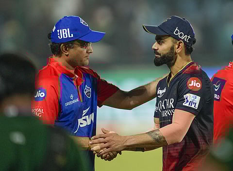 RCB player Virat Kohli with former cricketer Sourav Ganguly after the IPL 2023 cricket match against Delhi Capitals at the Arun Jaitley Stadium in New Delhi, May 6, 2023. (Photo | PTI)