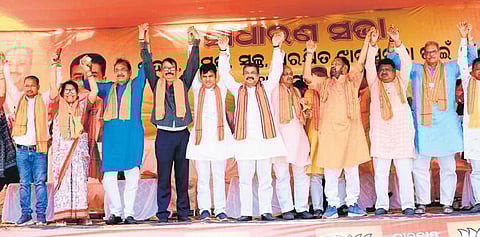 Union Minister Dharmendra Pradhan along with BJP candidate Tankadhar Tripathy and other leaders at a public rally in Jharsuguda on Sunday | Express